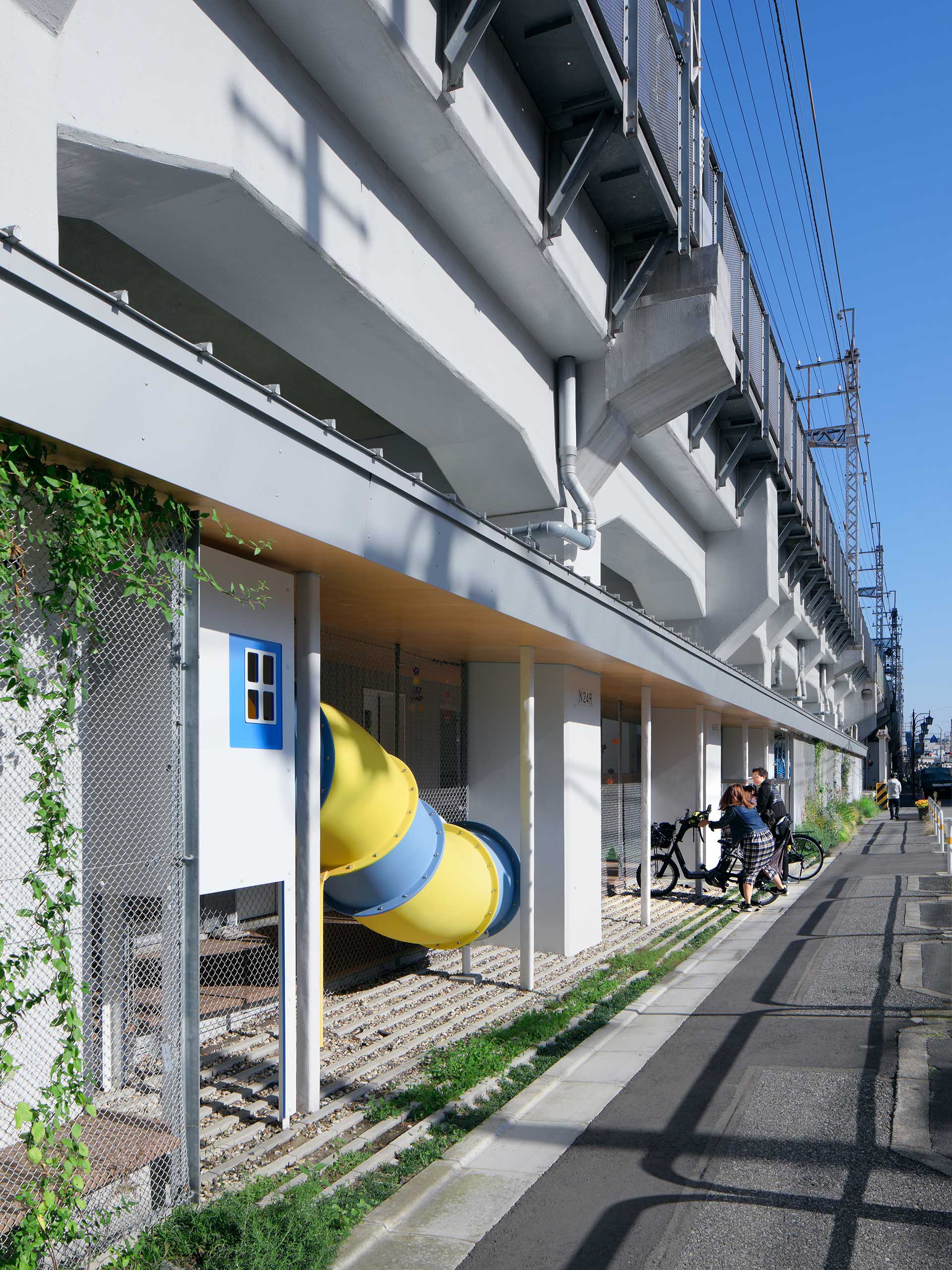 Nursery School Under Elevated Railway in Machiya