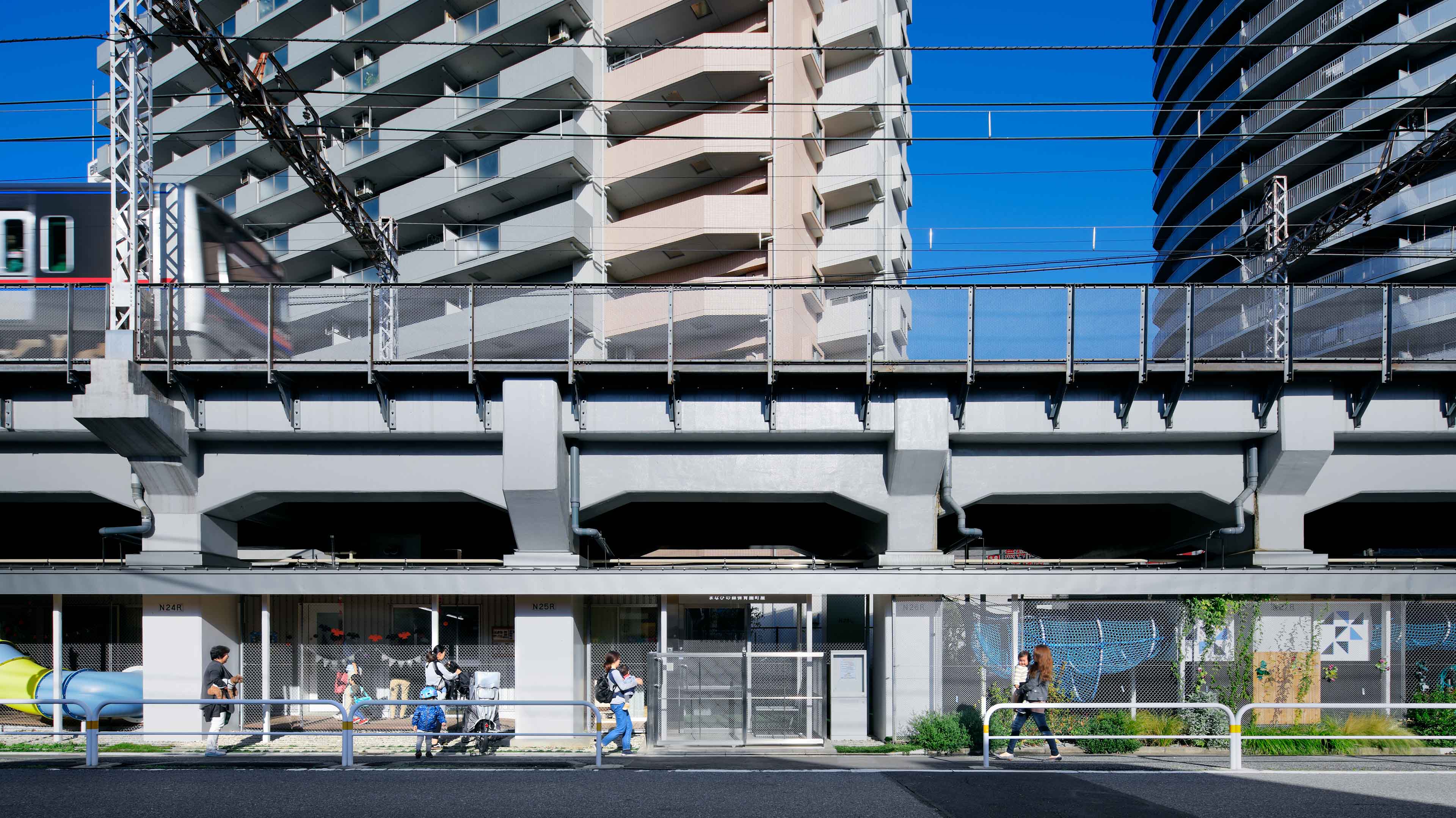 Nursery School Under Elevated Railway in Machiya