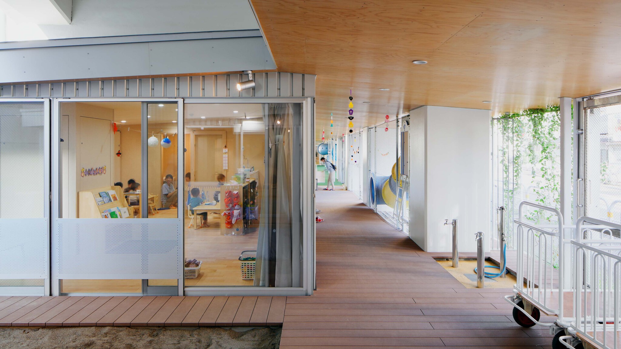 Nursery School Under Elevated Railway in Machiya